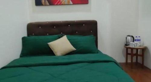 Letto o letti in una camera di OYO Home 90711 9 Roses Villa