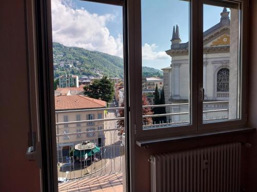a view of a city from a window at Residenza Cadorna in Como