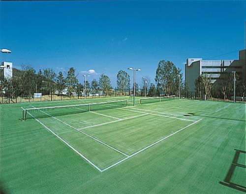 a tennis court with two tennis nets on it at GRAND NIKKO AWAJI in Awaji