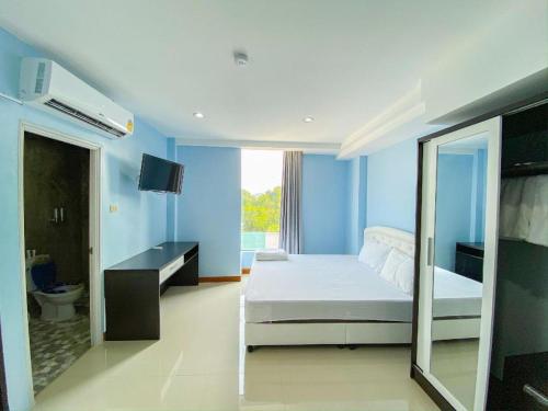 Ένα ή περισσότερα κρεβάτια σε δωμάτιο στο Delighted Bangkok Hotel