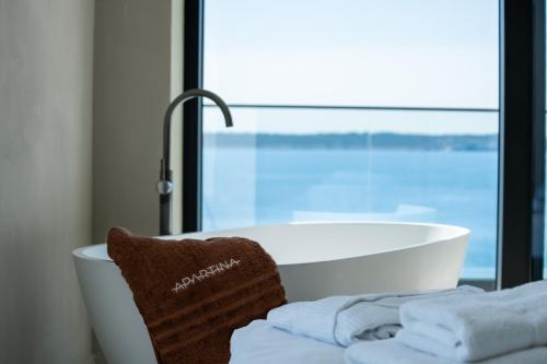 Postel nebo postele na pokoji v ubytování Apartina Boutique Suites