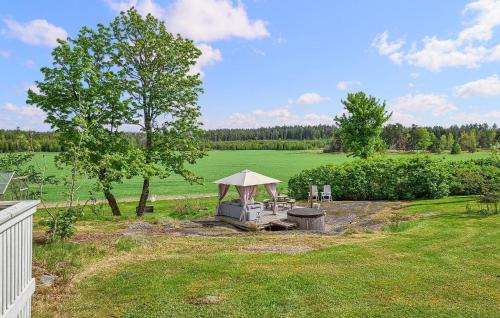 a backyard with a gazebo in a field at 4 Bedroom Cozy Home In Flo in Flo