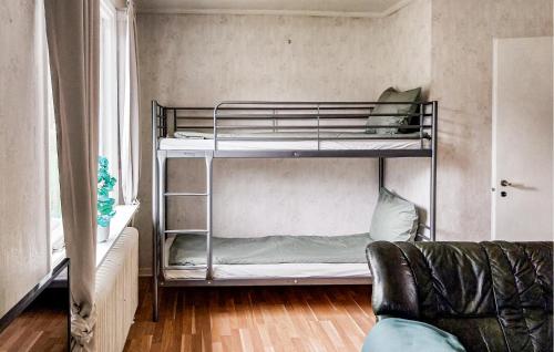 a room with two bunk beds and a couch at Pet Friendly Apartment In Gislatorp in Orrefors