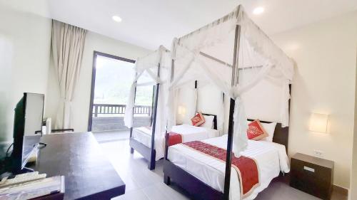 Voodi või voodid majutusasutuse Sài Gòn - Bản Giốc Resort toas