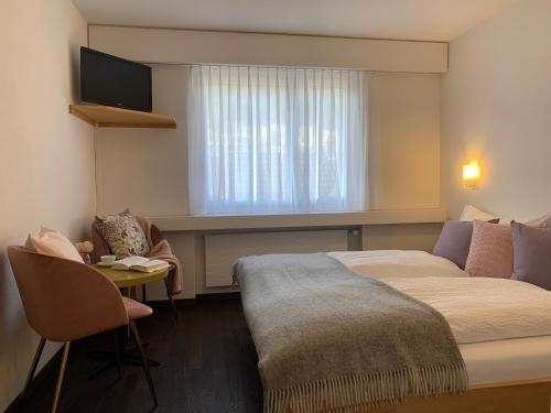 Postel nebo postele na pokoji v ubytování Hotel B&B Stossplatz