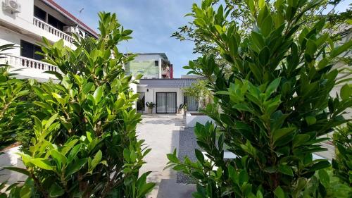 a view of the house from the garden at Breezy Bliss Home in Chiang Mai
