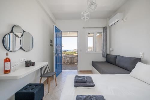 a living room with a couch and a table at ANESIS I in Livadi