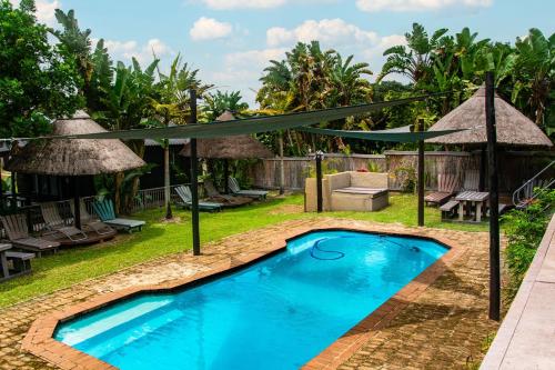 Πισίνα στο ή κοντά στο Nwabu Lodge Sodwana Bay