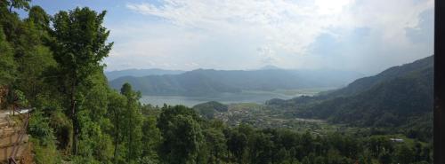 a view of a valley with a town and a river at Kailash villa and restro in Pokhara