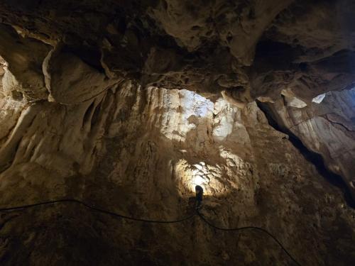 a cave with a flashlight in the middle of it at Kailash villa and restro in Pokhara