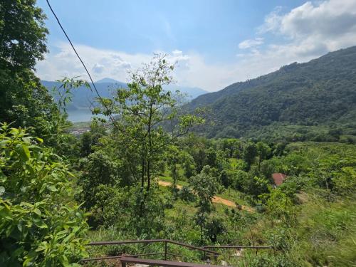 a view of a valley with mountains and trees at Kailash villa and restro in Pokhara