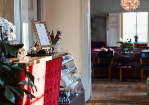a room with a counter with a picture on it at Rosersbergs Slottshotell in Rosersberg