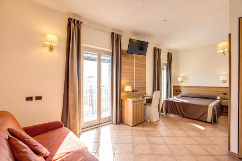 Postel nebo postele na pokoji v ubytování Hotel San Marco