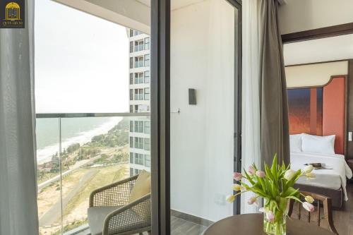 a hotel room with a view of the ocean at Mandala Oceanfront Driftwood Resort in Phan Thiet