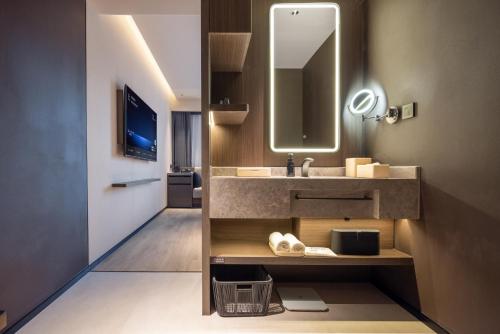 a bathroom with a sink and a mirror at Atour Hotel Beijing Haidian Qinghe MixC in Beijing