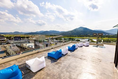 a group of blue and white chairs on a roof at Giverny Hotel in Gyeongju