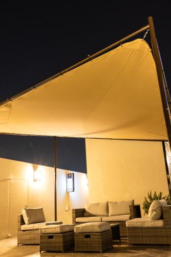 a tent with couches and tables in a room at Giverny Hotel in Gyeongju
