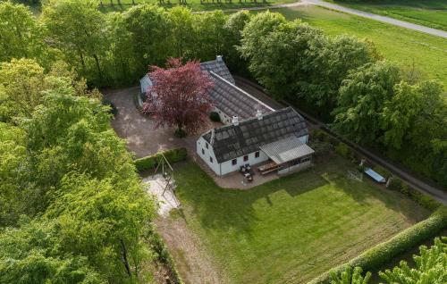 an aerial view of a house in a field at Beautiful Home In Skjern With Sauna in Skjern