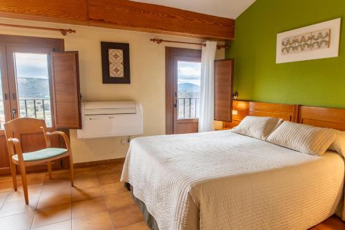 Postel nebo postele na pokoji v ubytování Hotel Rey Don Jaime