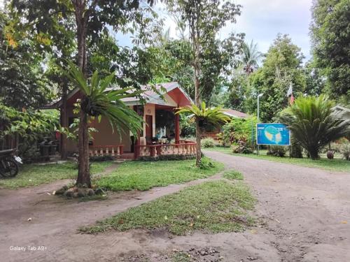 a house on the side of a road at Camiguin Lanzones Resort in Mambajao