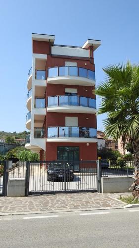 a tall building with a car parked in front of it at Hotel San Giorgio in Vasto