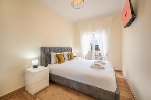 Ένα ή περισσότερα κρεβάτια σε δωμάτιο στο GuestReady – Quiet Escape in Setúbal