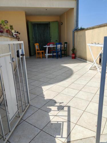 a patio with a table and chairs in a house at Fata Morgana in Casamassella
