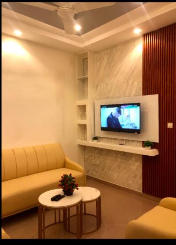 Noukpo Appartement Meublé TV 또는 엔터테인먼트 센터