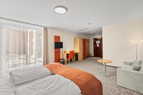 Ένα ή περισσότερα κρεβάτια σε δωμάτιο στο Hotel Schild