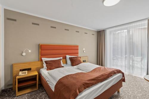 Ένα ή περισσότερα κρεβάτια σε δωμάτιο στο Hotel Schild