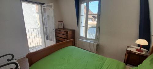 Ένα ή περισσότερα κρεβάτια σε δωμάτιο στο Appart 2 chambres terrasse prive Levroux