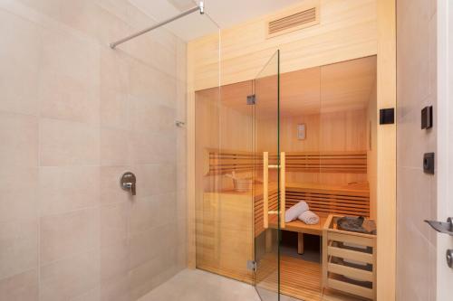 a shower with a glass door in a bathroom at Villa Old Olive IV - Heated Pool - by Vivi Rent in Vodnjan