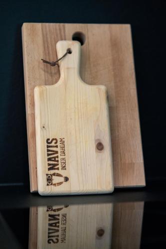 a wooden baseball bat sitting on top of a table at Nagelehof Apartment Bendelstein in Navis