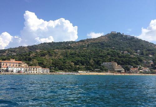 a view of a mountain from the water at Residenza D'epoca 1861 in Santa Maria di Castellabate