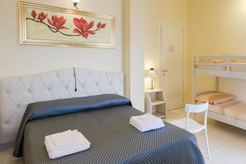 Кровать или кровати в номере Hotel Salento Gold Beach