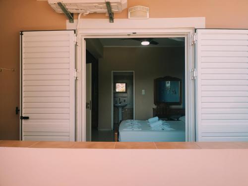 an open door to a bedroom with a bed at kyriaki room 5 in Vouvás