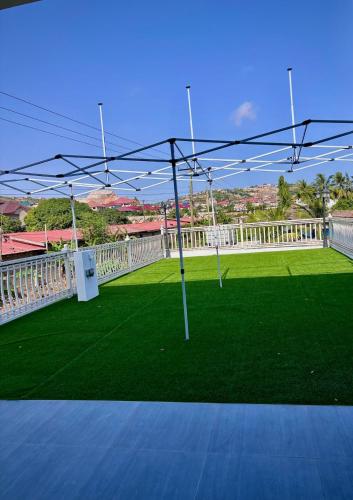 a view of a soccer field with a goal at Izire Home in Tokuse