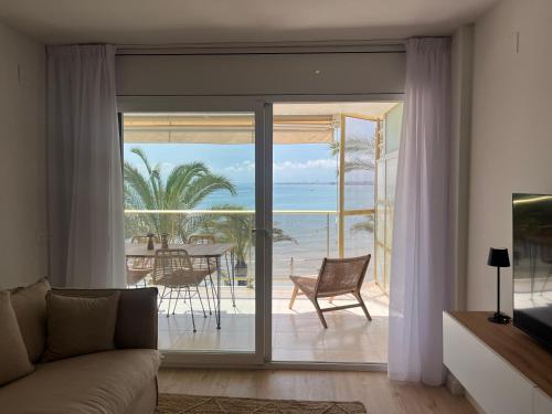 a living room with a view of the ocean at Salou SEA SUNSET in Salou