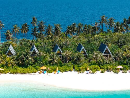 a resort on a beach with palm trees and the ocean at Oaga Art Resort Maldives - Greatest All Inclusive Plan with Free Speedboat Round-trip in North Male Atoll