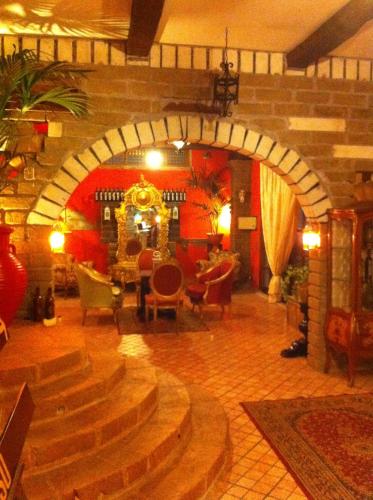 a living room with an archway in a building at AgriSesto B&B in Fregene