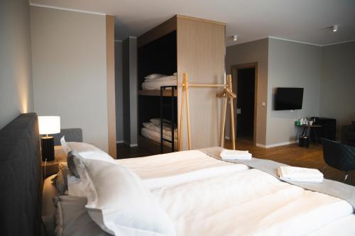 Una cama o camas en una habitación de Hótel Vesturland