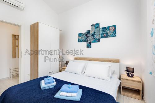 Postel nebo postele na pokoji v ubytování Apartmani Lesjak