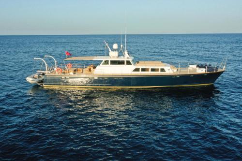 a boat sitting in the middle of the water at Faustino Gran Relais & Chateaux in Ciutadella