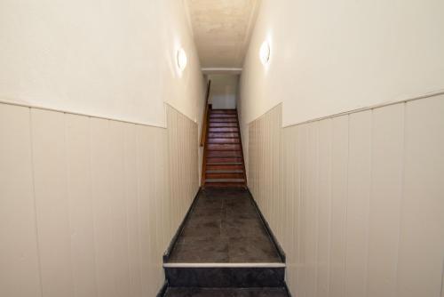 a hallway with a staircase in a baseball field at Engineer Lane House in Gibraltar