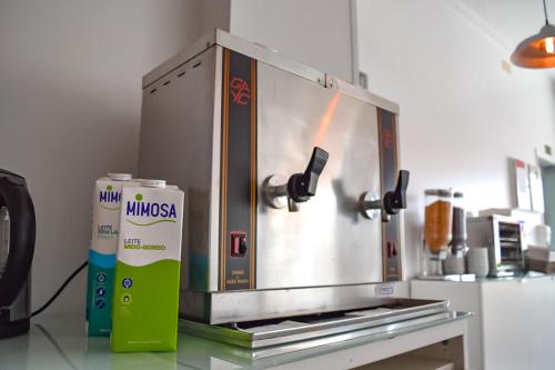 a coffee maker on a counter in a kitchen at Residência Maciel in Peniche
