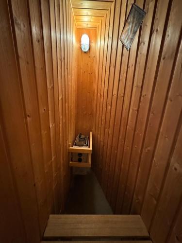 a wooden sauna with a sink and a stove at Red Flat Paris in Paris