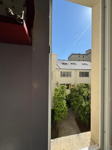 a view of a building from a window at Red Flat Paris in Paris
