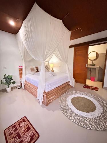 Ένα ή περισσότερα κρεβάτια σε δωμάτιο στο Mount Batur sunrise Jeep and Lodge