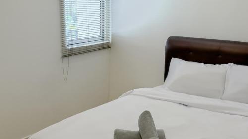 Ένα ή περισσότερα κρεβάτια σε δωμάτιο στο Lake Garden View Homestay with Pool and Netflix