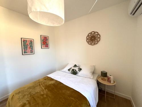 En eller flere senge i et værelse på M113 Marquer Superbe T2 proche de la douane Moillesulaz et de Genève